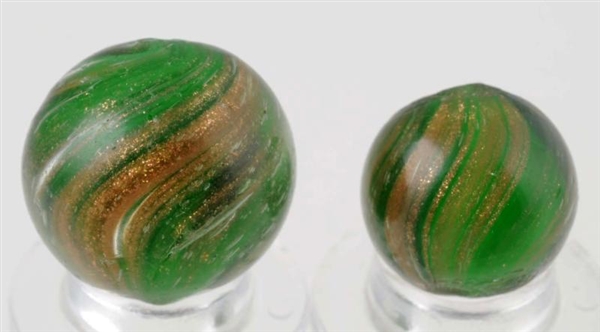 LOT OF 2: GREEN GLASS LUTZ MARBLES.               