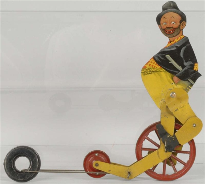 EARLY AMERICAN TIN LITHO HOBO CYCLIST TOY.        