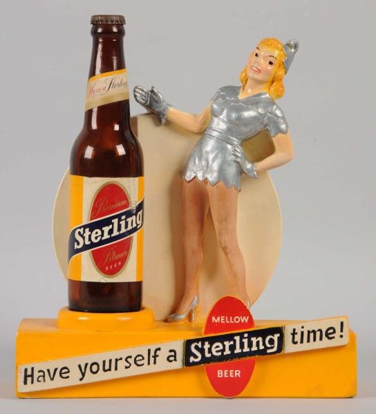 STERLING ADVERTISING FIGURE WITH BOTTLE.          