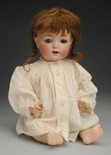 SMILING K & R CHARACTER BABY DOLL.                