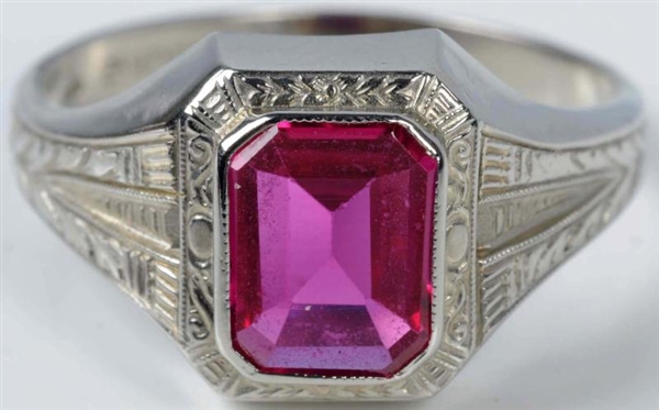 10K WHITE GOLD RING WITH SYNTHETIC RUBY.          