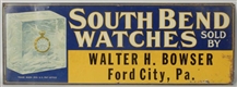TIN SOUTH BEND WATCHES SIGN.                      