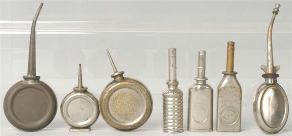 LOT OF 7: SMALL OIL CANS.                         