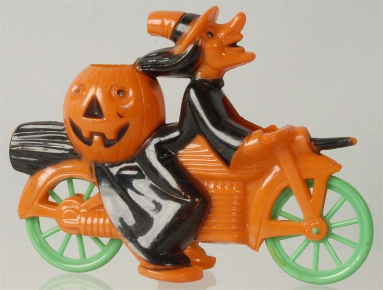 VINTAGE PLASTIC HALLOWEEN WITCH ON MOTORCYCLE.    