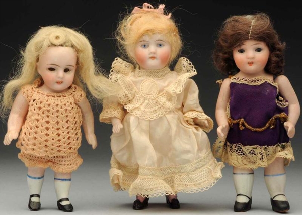 LOT OF 3: ALL-BISQUE DOLLS.                       