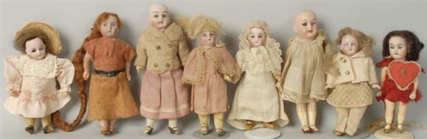 LOT OF 8: SMALL GERMAN BISQUE DOLLS.              