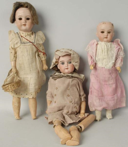 LOT OF 3: A.M. GERMAN BISQUE DOLLS.               