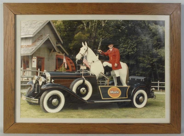 LARGE FRAMED PHOTO OF THE MOXIEMOBILE.            