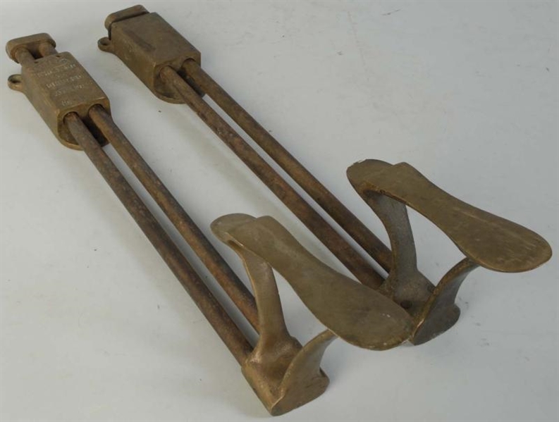 PAIR OF BRASS ADJUSTABLE FOOT RESTS.              