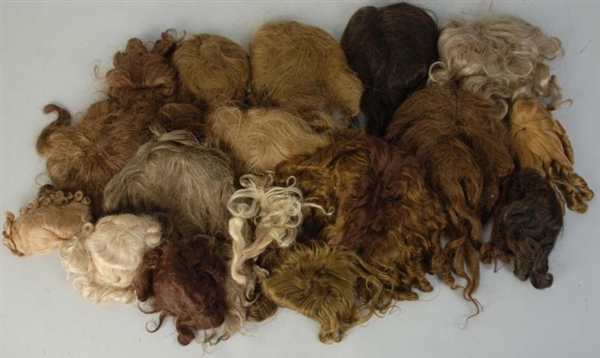 LOT OF 18: ASSORTED DOLL WIGS.                    