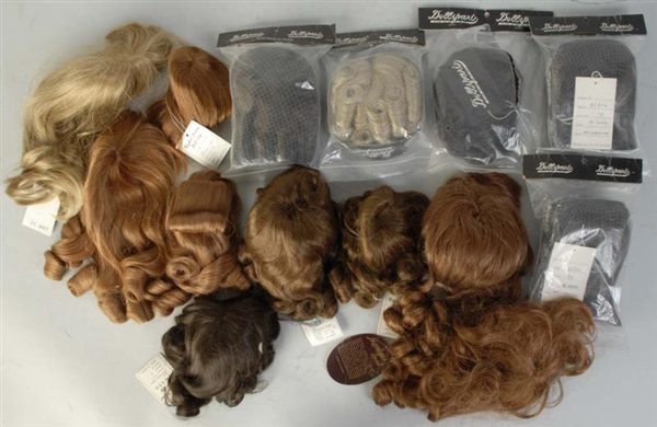 LOT OF 14: ASSORTED DOLL WIGS.                    