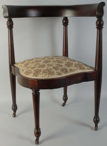 WALNUT CORNER CHAIR WITH EMBROIDERED SEAT.        