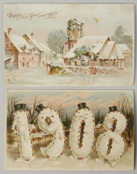 LOT OF 2: HOLD-TO-LIGHT NEW YEARS POSTCARDS.     