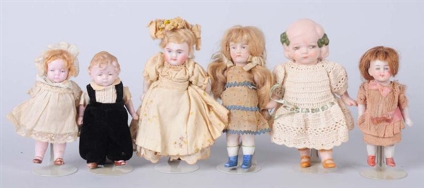 LOT OF 6: ALL-BISQUE DOLLS.                       