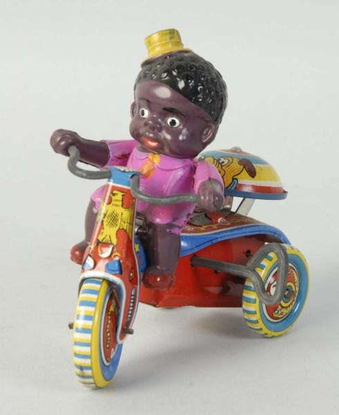 CELLULOID BOY ON TRICYCLE TOY.                    