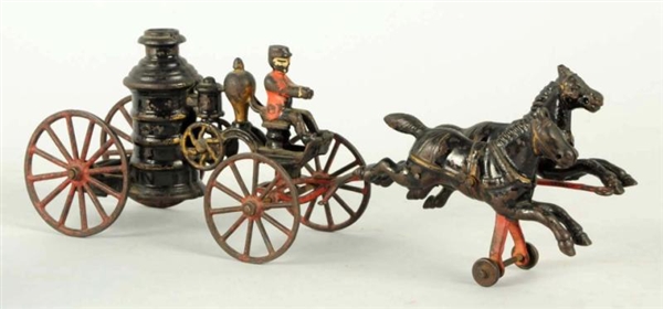 CAST IRON AMERICAN MADE FIRE PUMPER TOY.          