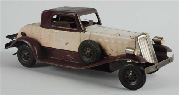 PRESSED STEEL WIND-UP GIRARD DELUXE COUPE.        