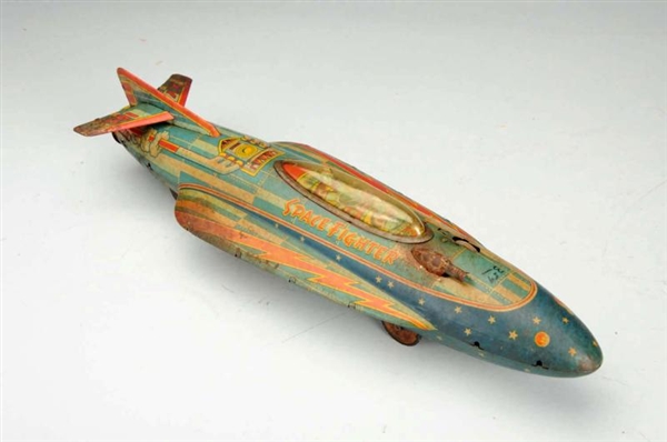 JAPANESE TIN LITHO FRICTION SPACE FIGHTER TOY.    