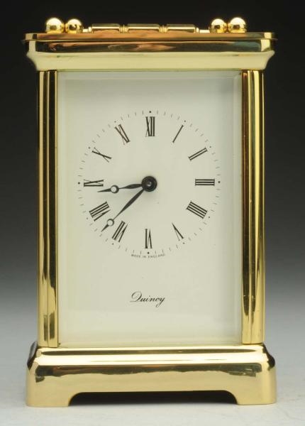 GOLD QUINCY CARRIAGE CLOCK.                       