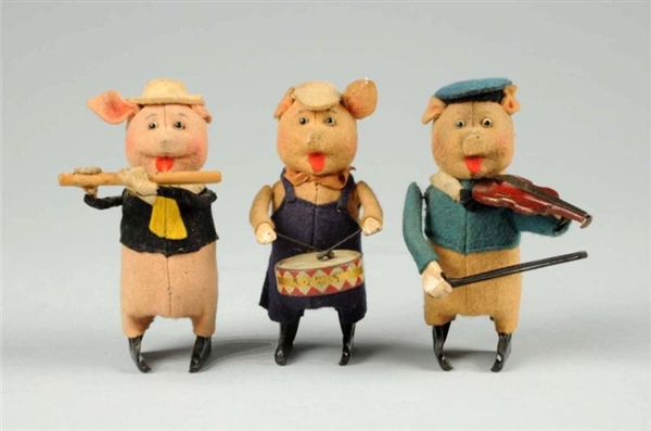 LOT OF 3: GERMAN SCHUCO WIND-UP PIG BAND MEMBERS. 