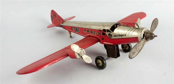 FRENCH TIN WIND-UP AIRPLANE.                      