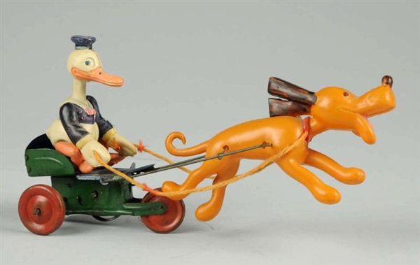 JAPANESE CELLULOID DONALD DUCK CART TOY.          