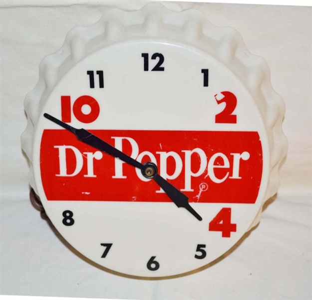 DR. PEPPER 10-2-4 BOTTLE CAP SHAPED CLOCK.        