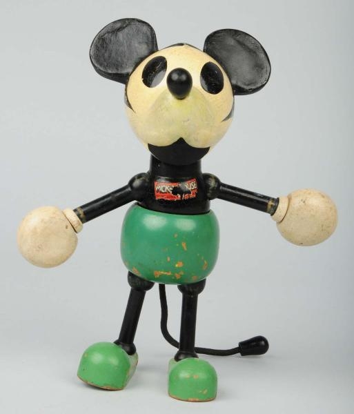 WOODEN MICKEY MOUSE WITH LOLLIPOP HANDS.          