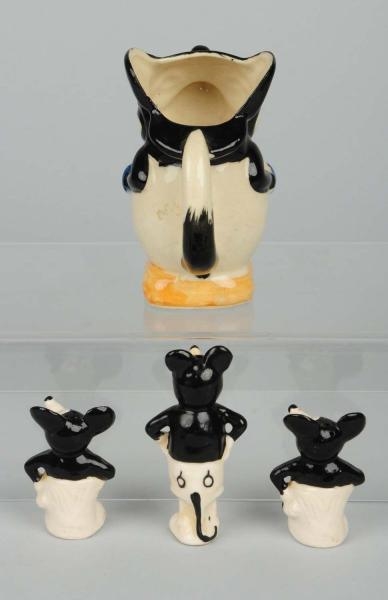 LOT OF 4: MICKEY MOUSE CERAMIC FIGURES.           