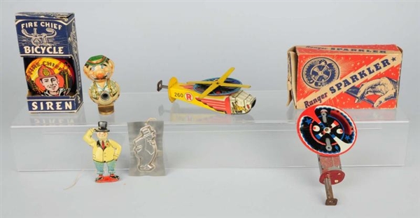 LOT OF 7: ASSORTED TIN TOYS.                      