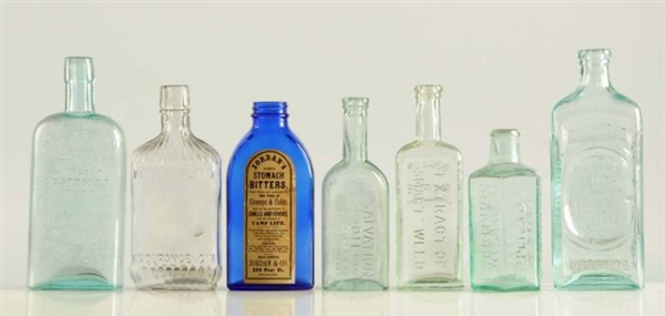LOT OF 7: EARLY ADVERTISING BOTTLES.              