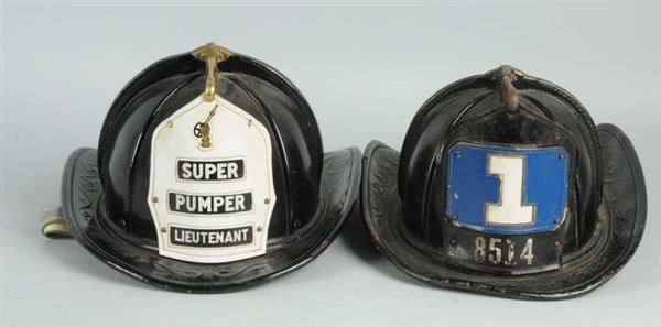 LOT OF 2: LEATHER FIRE HELMETS FROM FDNY.         