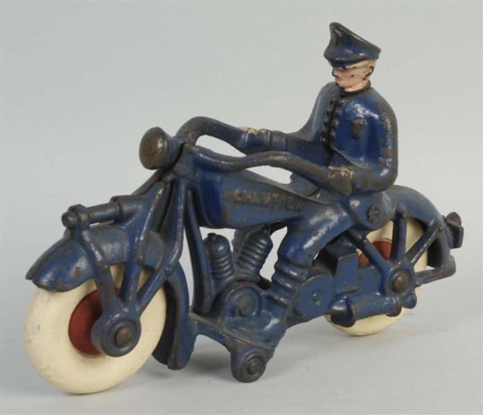 CAST IRON CHAMPION POLICE MOTORCYCLE TOY.         
