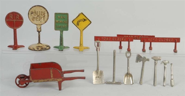 LOT OF ARCADE CAST IRON SIGNS & TOOLS.            