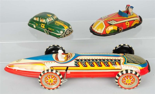 LOT OF 3: VINTAGE TIN WIND UP TOYS.               