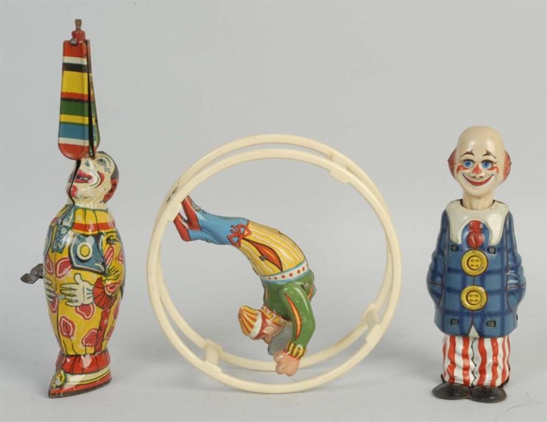 LOT OF 3: TIN WIND UP CLOWNS TOYS.                