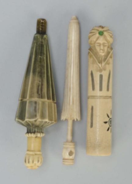 LOT OF 3: FIGURAL SEWING NEEDLE CASES.            