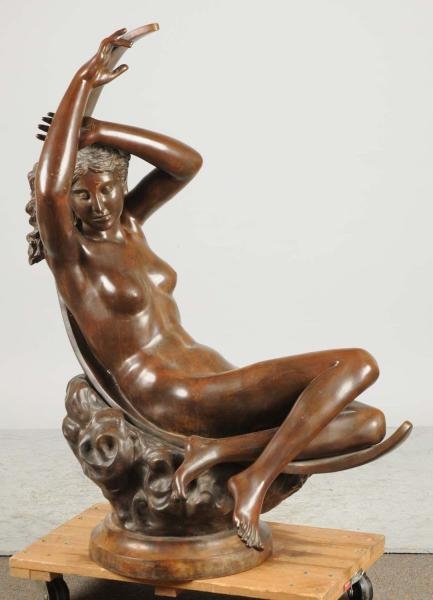 BRONZE NUDE IN SITTING POSITION.                  