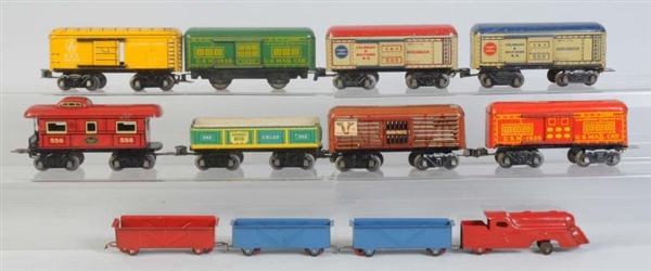 LOT OF 8+ SIX INCH TIN FREIGHT CARS.              