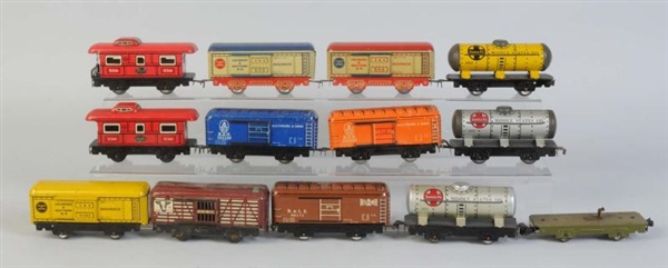 ASSORTED MARX 6" TIN FREIGHT CARS.                