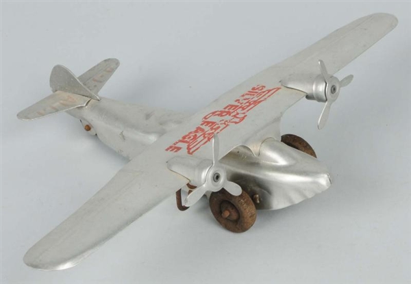 TIN WIND-UP SILVER EAGLE AIRPLANE.                
