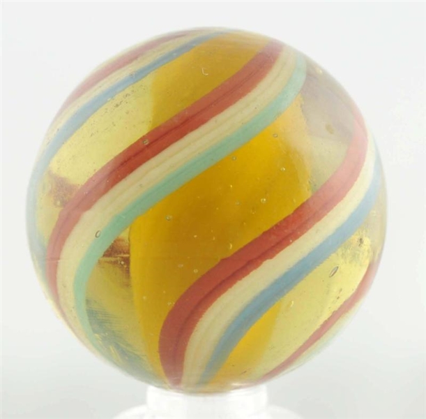 LARGE YELLOW GLASS SOLID CORE SWIRL MARBLE.       
