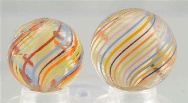 LOT OF 2: CAGED WHITE SOLID CORE MARBLES.         