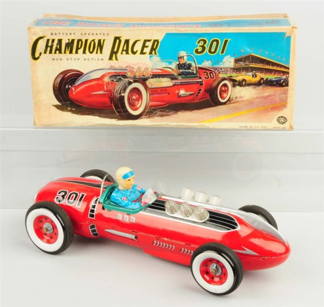 JAPANESE BATTERY OPERATED CHAMPION RACECAR TOY.   
