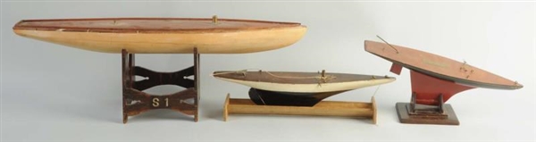 LOT OF 3: WOODEN SAILBOATS WITH STANDS.           