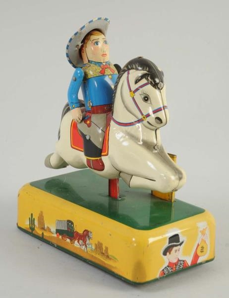 JAPANESE TIN COWBOY AND HORSE TOY.                