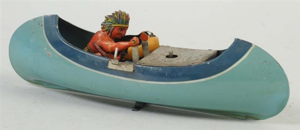 TIN WIND-UP INDIAN IN BOAT.                       