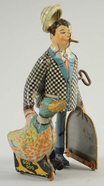 MARX TIN WIND-UP MAN WITH DUCK.                   