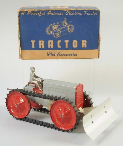 TIN WIND-UP TRACTOR.                              