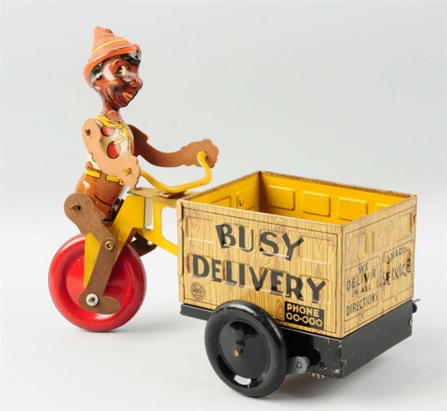 TIN WIND-UP BUSY DELIVERY BOY.                    